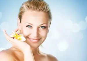 Woman smiling with flower